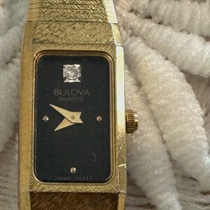 Vintage Bulova gold band with black with diamond watch